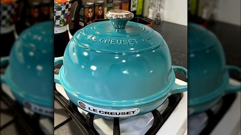 Caribbean Le Creuset bread dome on stove top.
