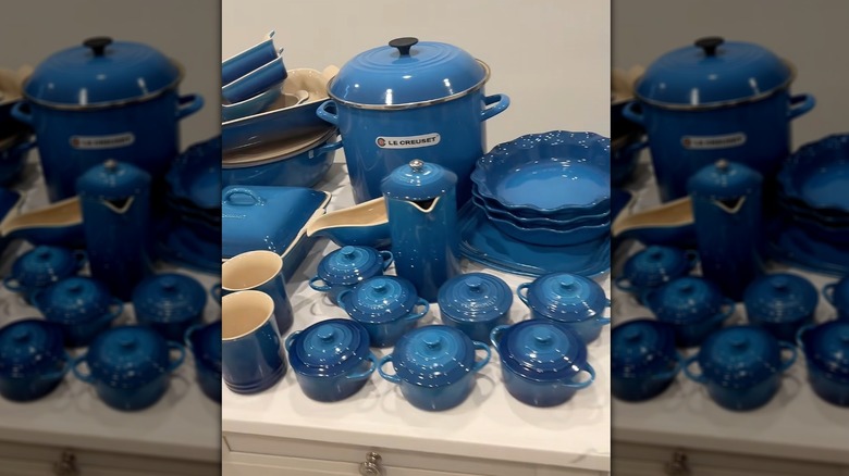 Spread of marseille Le Creuset products on kitchen counter.