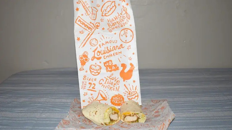 Popeyes chicken snack wrap with the chain's takeout bag