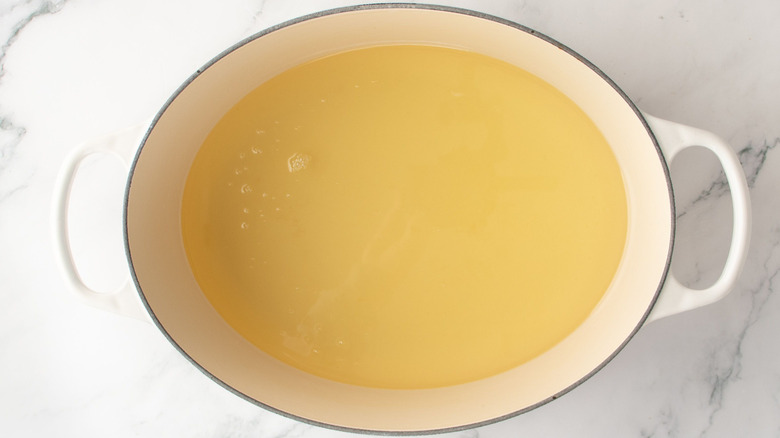 Large pot half full with oil