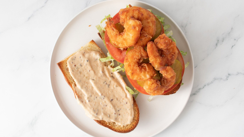Open faced po' boy with fried shrimp