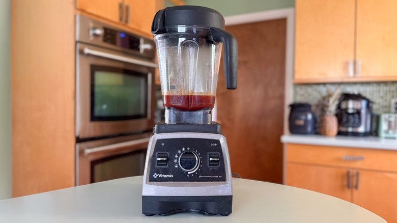Honey bourbon BBQ sauce in high-speed blender on countertop