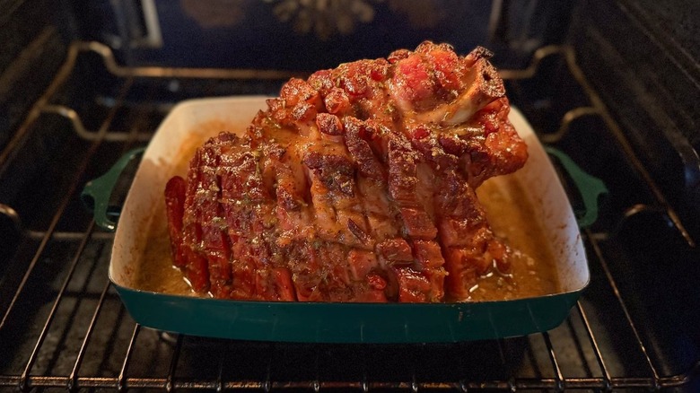 Miso and maple-glazed ham baking in oven