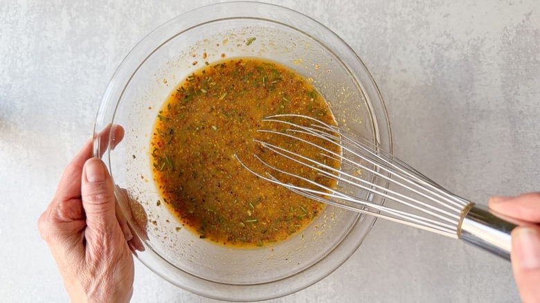 Whisking miso maple glaze in glass bowl