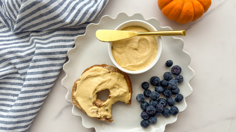 bagel and cream cheese on plate
