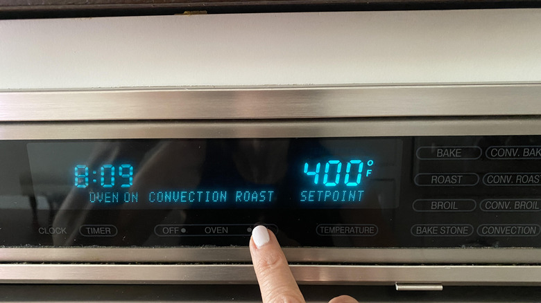 hand setting oven temperature