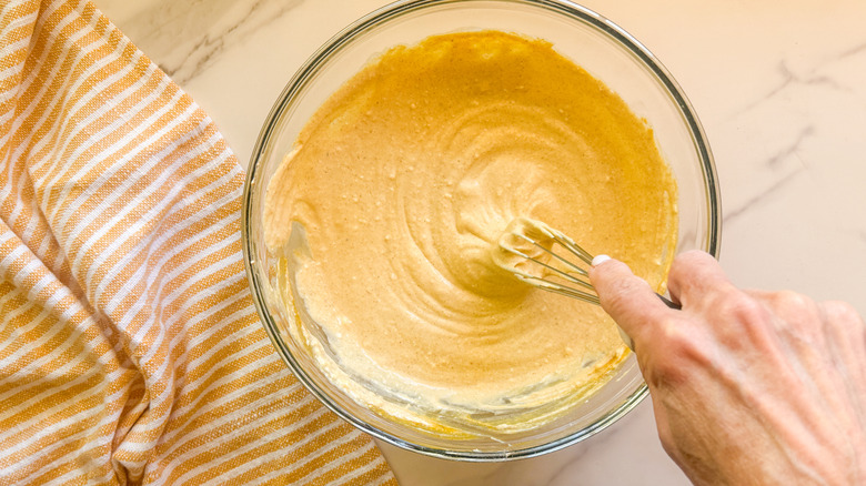 hand stirring with whisk
