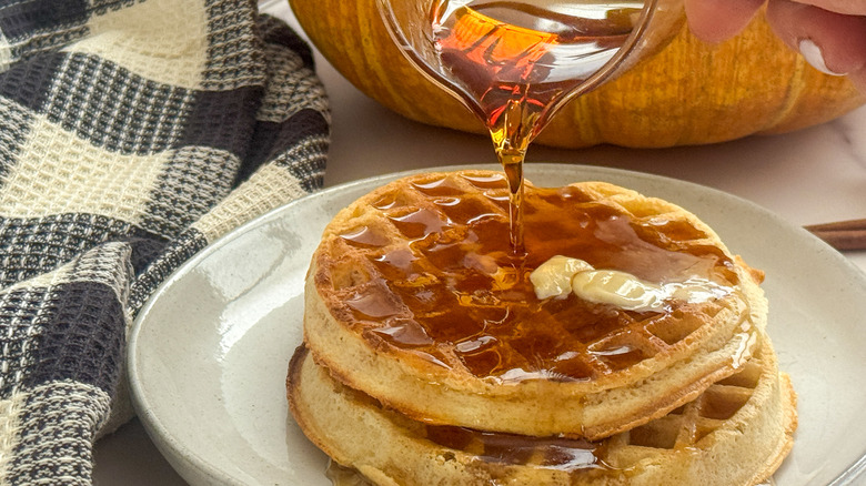 syrup pouring on waffles