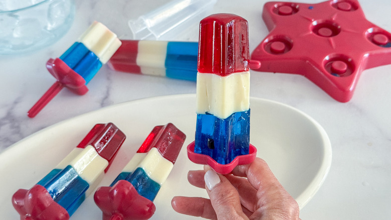 hand holding rocket pop