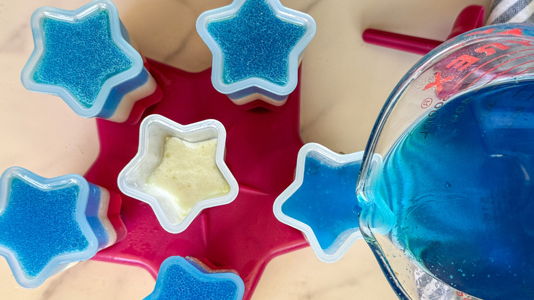 pouring blue mixture into mold