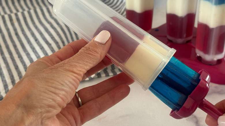 hand pulling out rocket pop