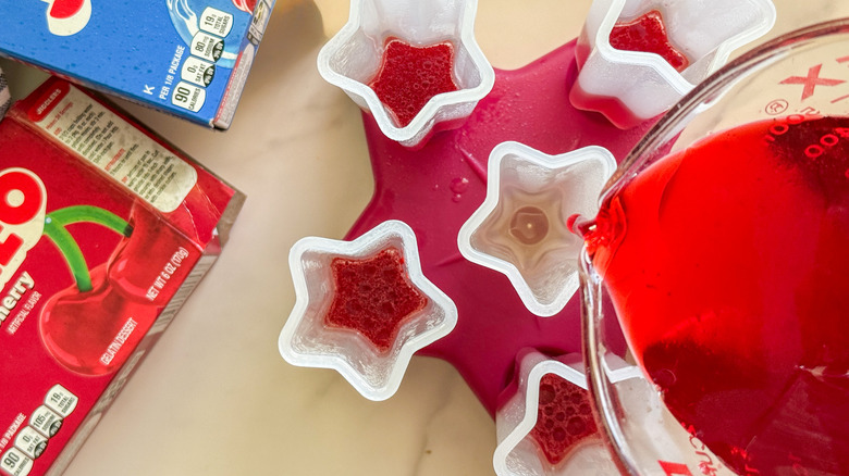 pouring red mixture into mold