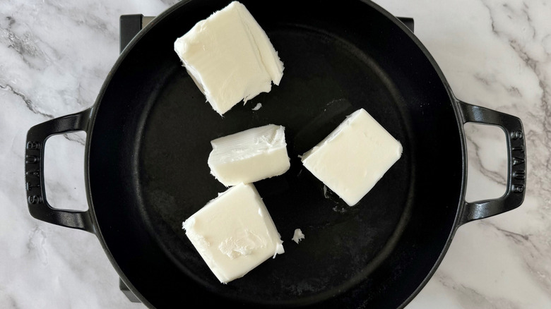 Pieces of lard in large skillet