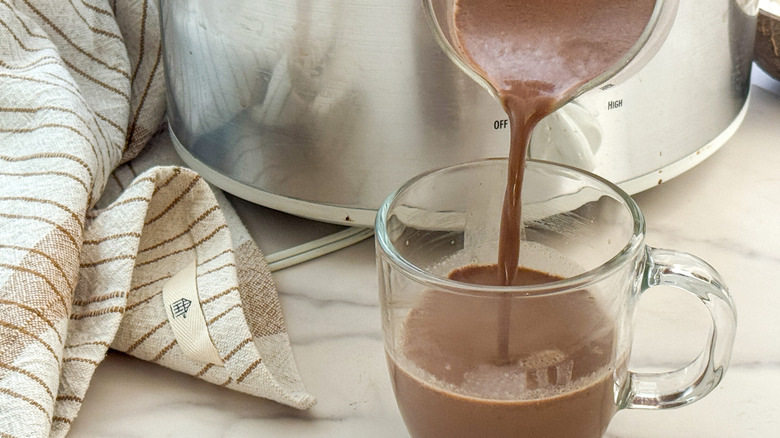 ladle of hot chocolate into mug
