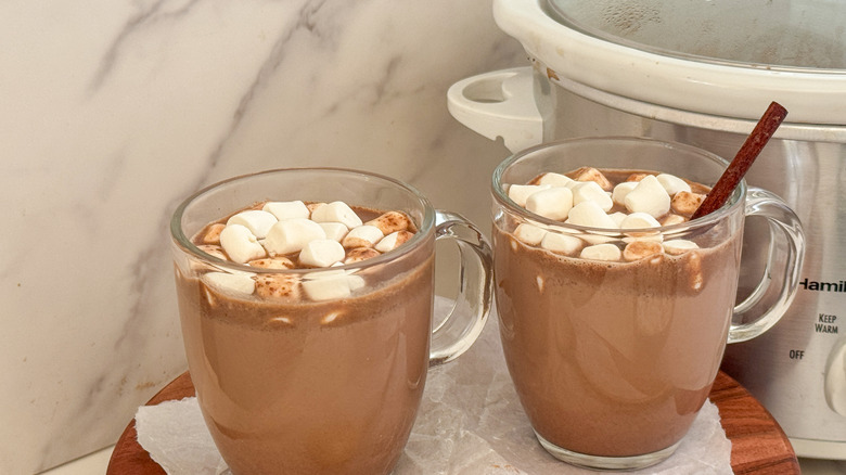 2 mugs next to slow cooker