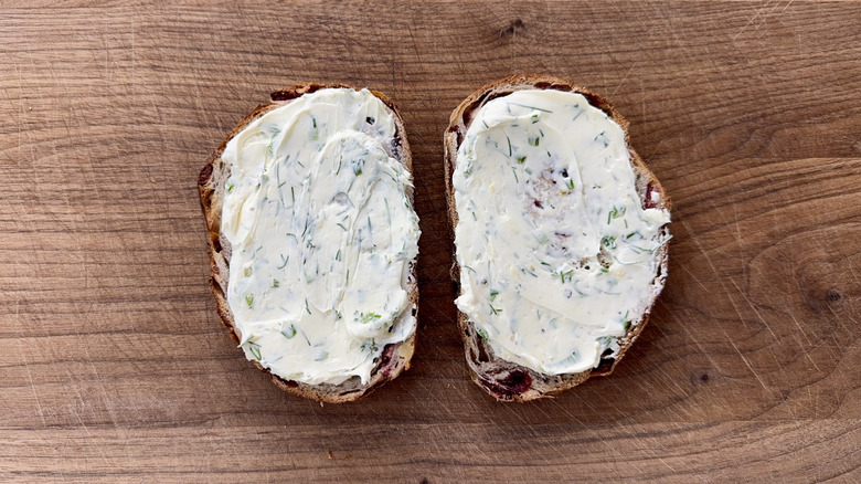Cream cheese spread on two slices of toast