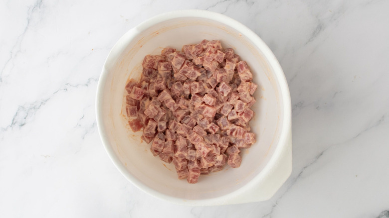 Cubed raw tuna in bowl