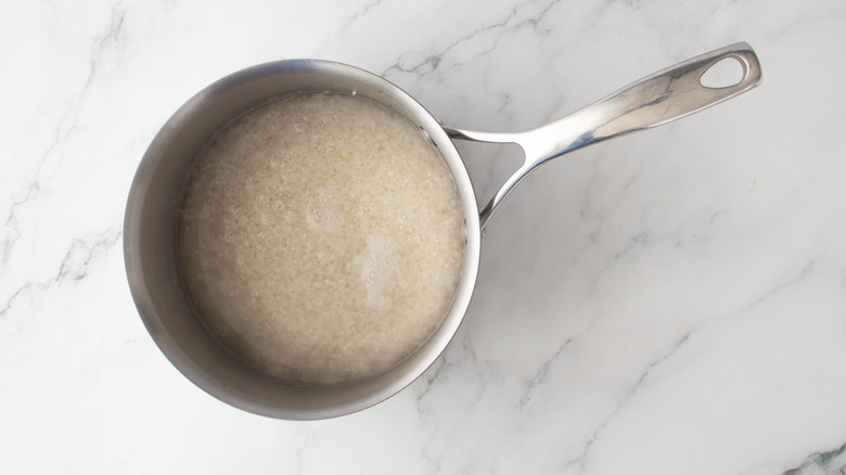 Rice and water in saucepan