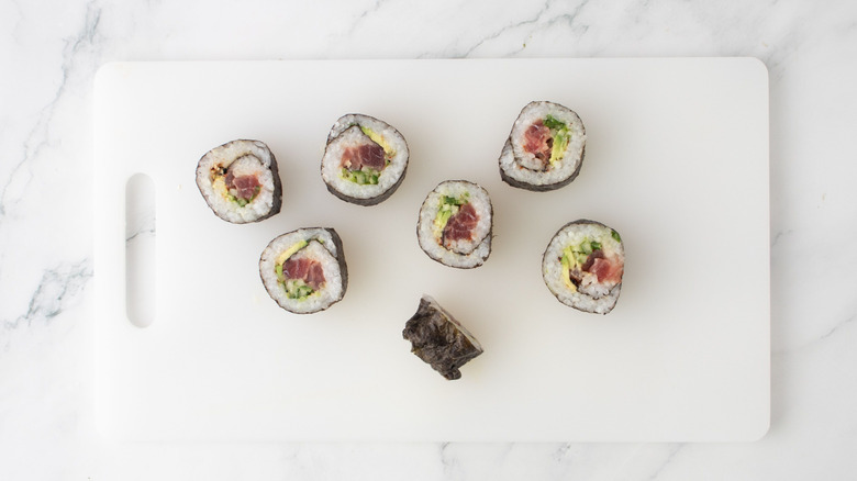 Sushi pieces on cutting board