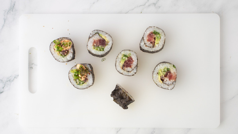Sushi pieces on cutting board