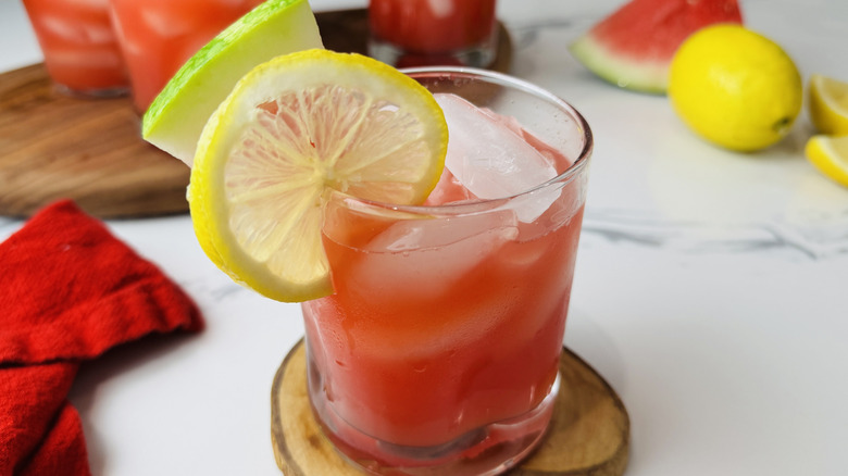 glass of watermelon lemonade with fruit garnish