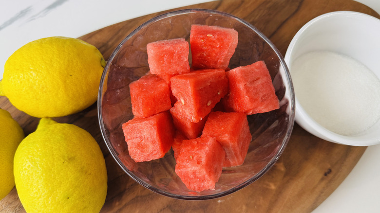 lemons, cubed watermelon, and sugar