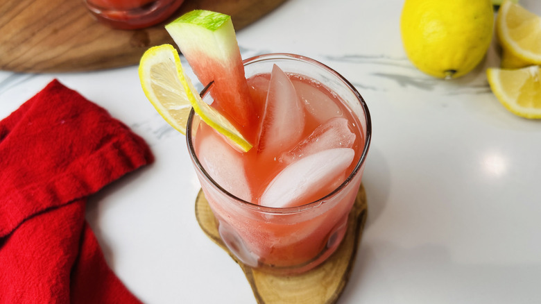 glass of watermelon lemonade with fruit garnish