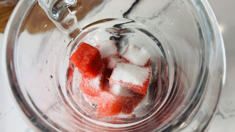 cubed watermelon and sugar in blender