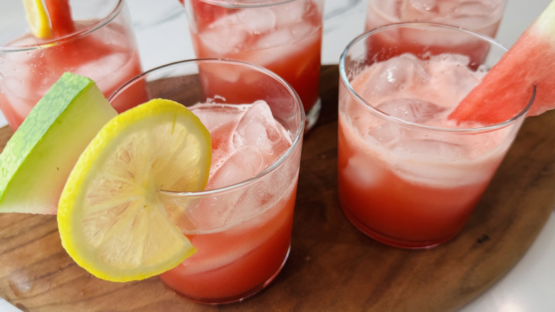 glasses of watermelon lemonade with fruit garnish