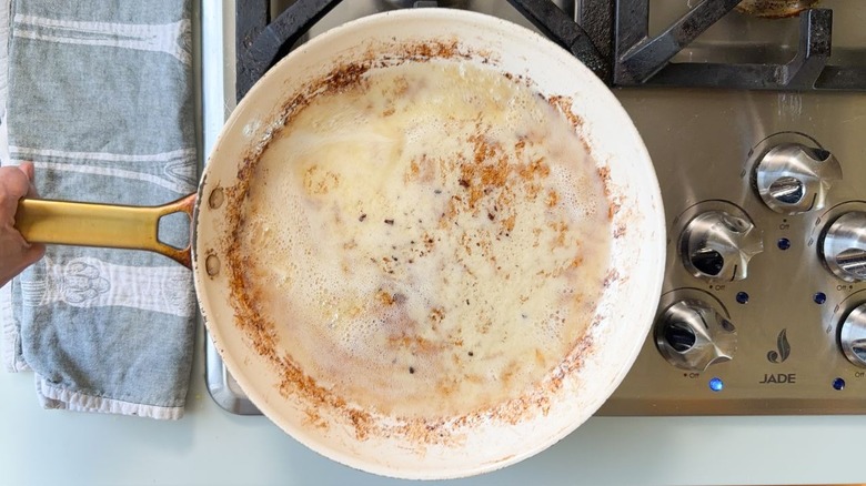 Bacon fat brown butter cooking in skillet on stovetop