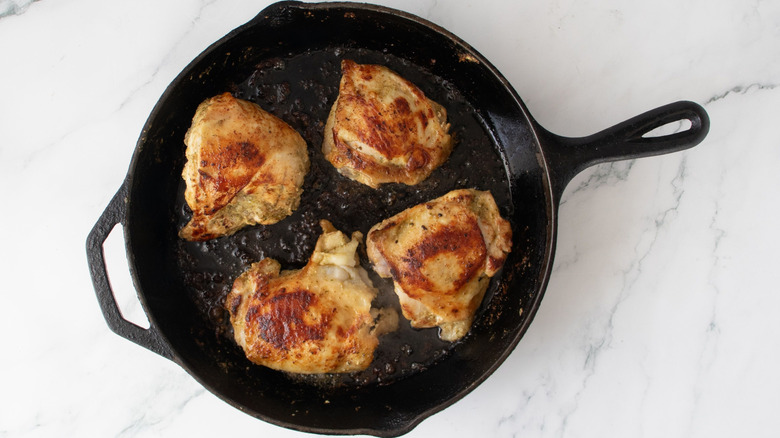 Seared chicken in skillet
