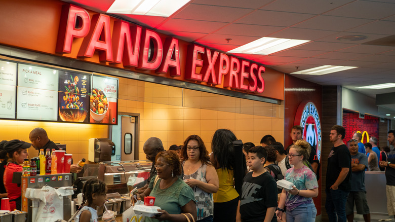 People lined up at a Panda Express counter