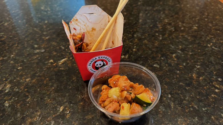Panda Express takeout box and bowl with Kung Pao Chicken