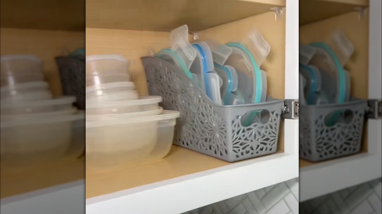 Magazine file organizer holding Tupperware lids