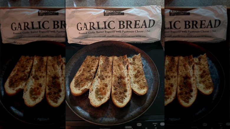 Package of Roasted Garlic Butter Baguette with Parmesan Cheese, with some slices on a plate