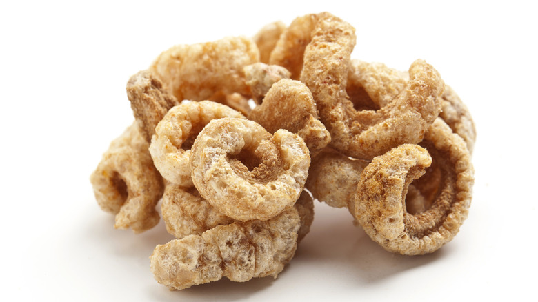 Pile of pork rinds on a white background