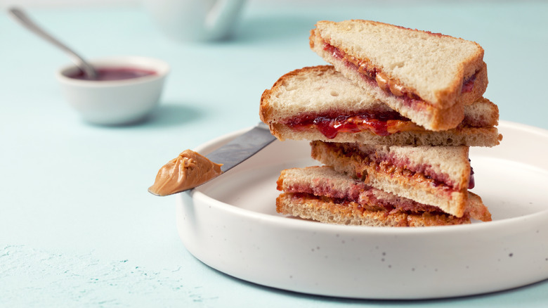 Peanut butter and jelly sandwiches stacked in bowl