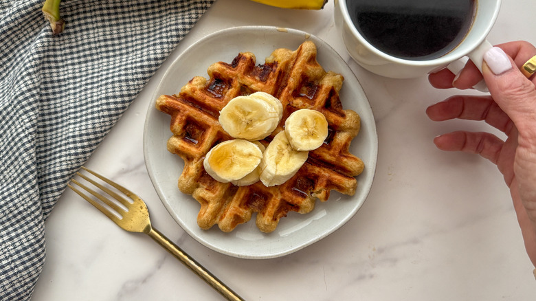 waffle served with banana slices and coffee