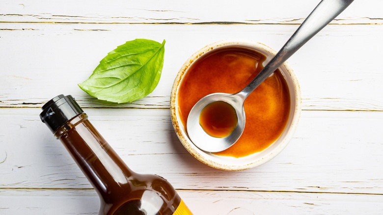 A ramekin of Worcestershire sauce.