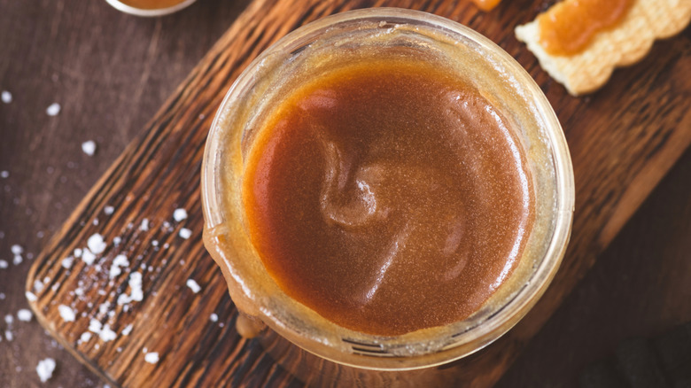glass jar full of caramel sauce