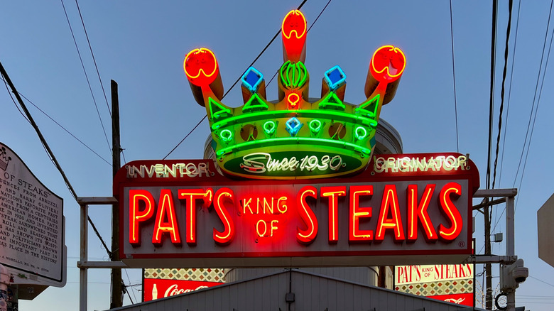 The neon sign for Pat's King of Steaks