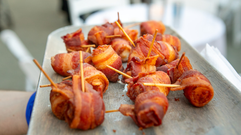 Bacon wrapped appetizer on a plate