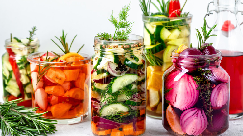Colorful pickled veggies in glass jars