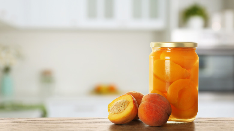 Pickled peaches in a jar