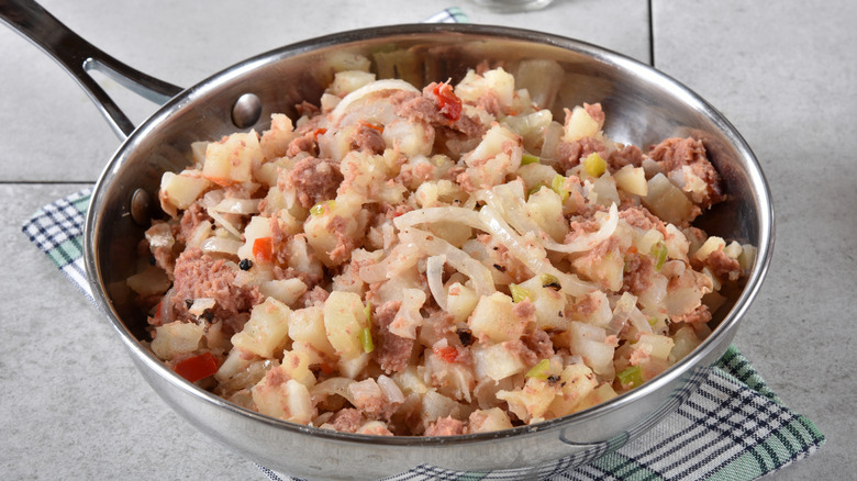 Corned beef hash in stainless steel skillet