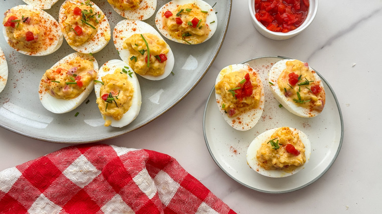 pimento deviled eggs on serving plate