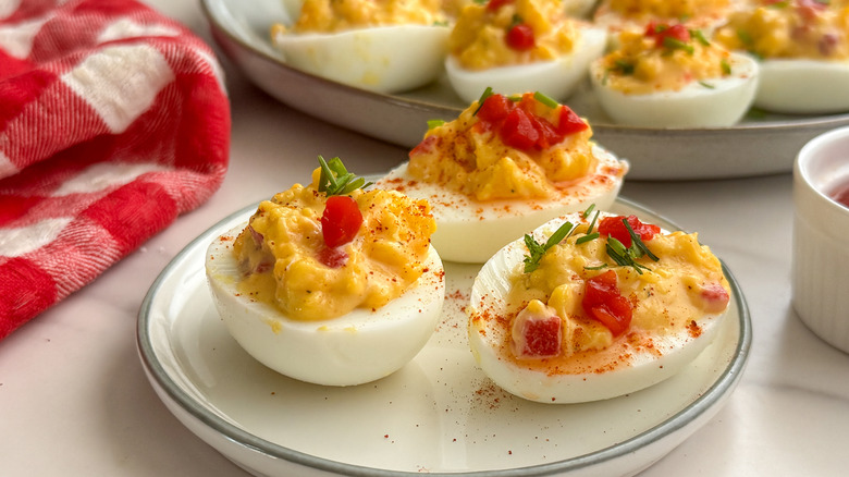 pimento cheese deviled eggs on plate