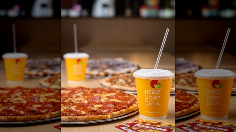 A drink cup reading Peter Piper Pizza beside a Funpass game card and a pepperoni pizza