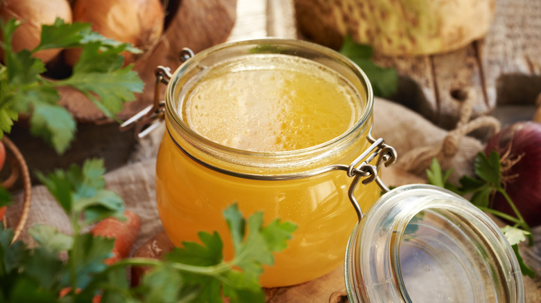 A glass jar filled with broth