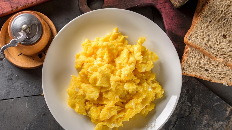 Creamy plated scrambled eggs.